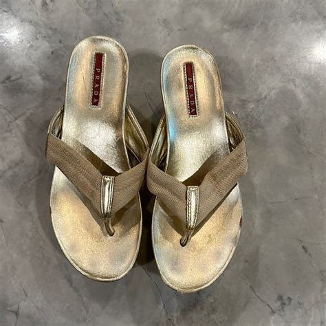 prada gold flip flops